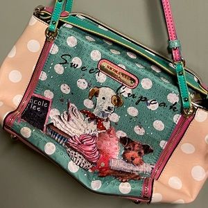 I am selling a Nicole Lee purse with dogs and cupcakes on it